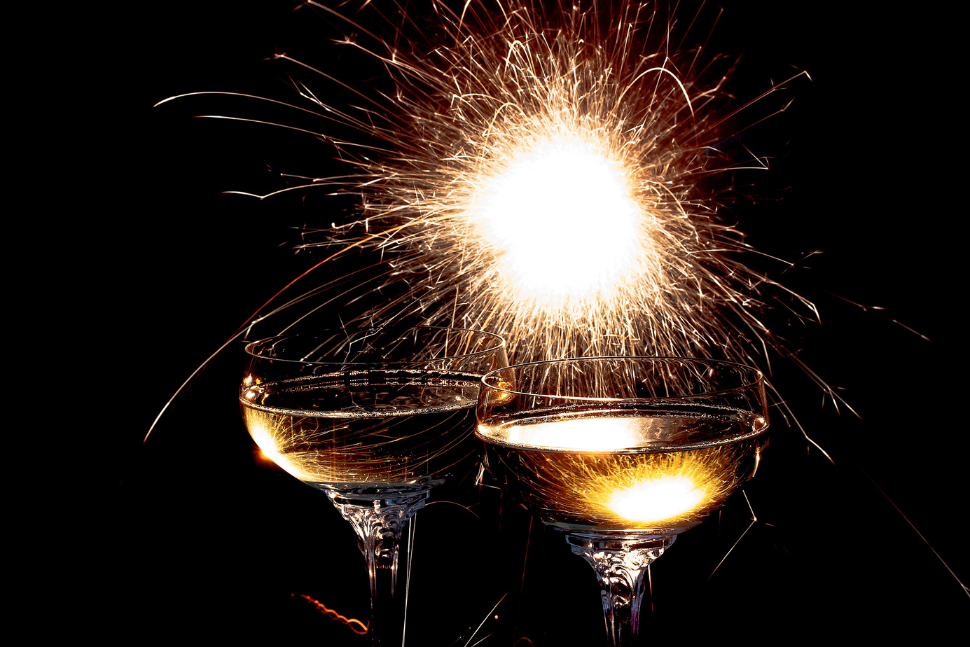 Champagne Glasses on Firework Background